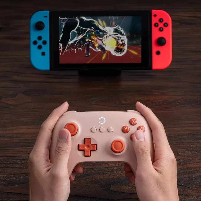 8Bitdo (Orange) in hand